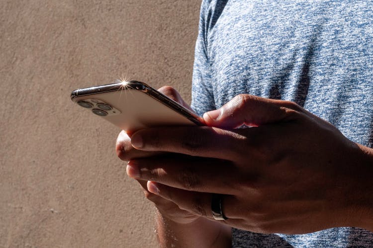 A Man handling a phone receiving an SMS