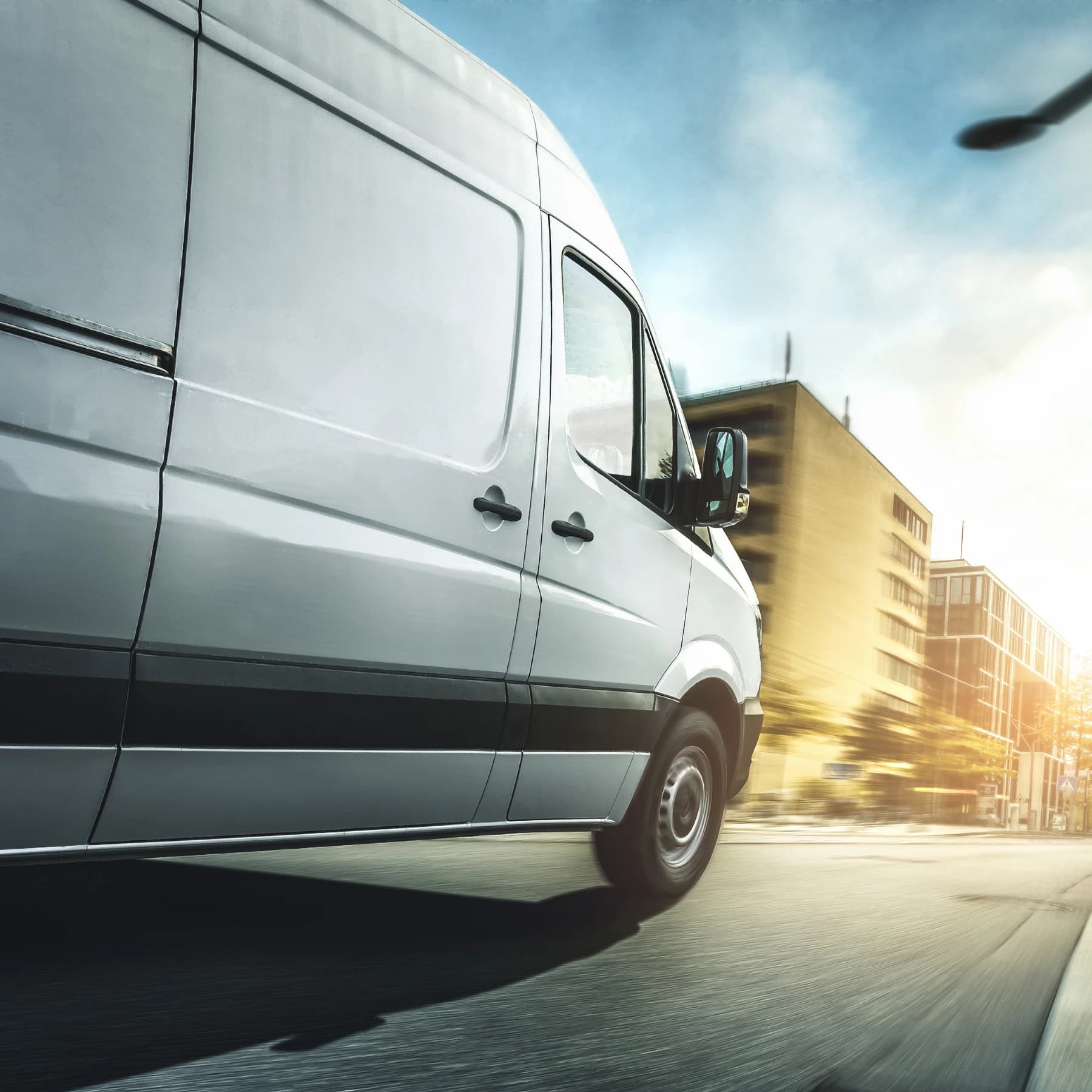 A delivery truck quickly reaching its destination inside a city downtown