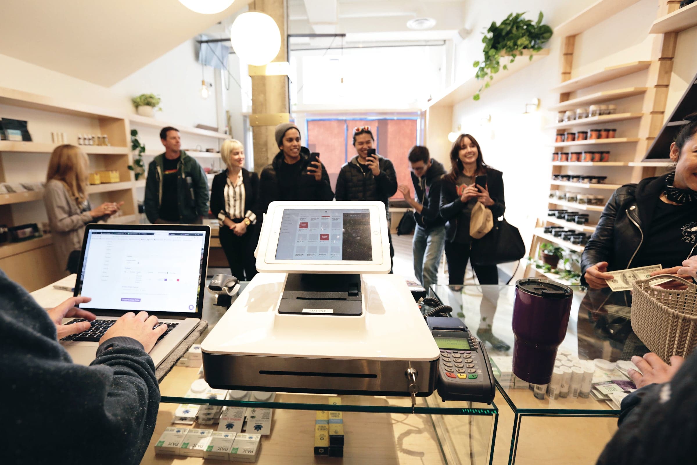 A small crowd gathered inside The Vapor Room at their soft opening