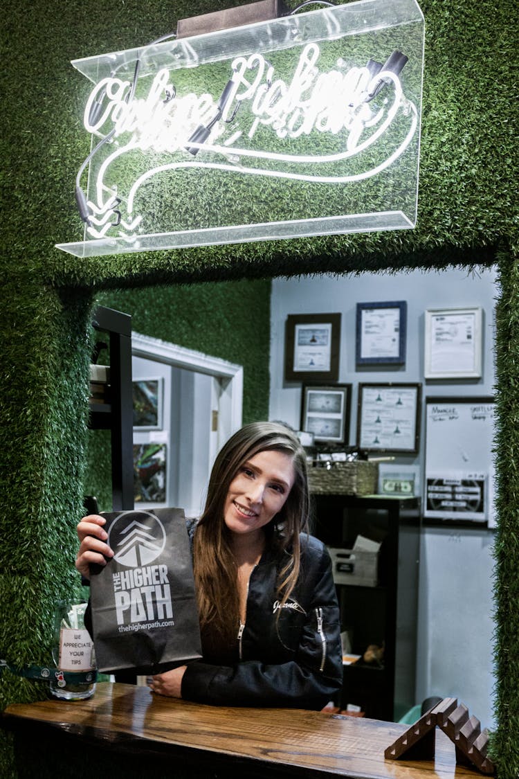 A budtender displays a pickup order at The Higher Path