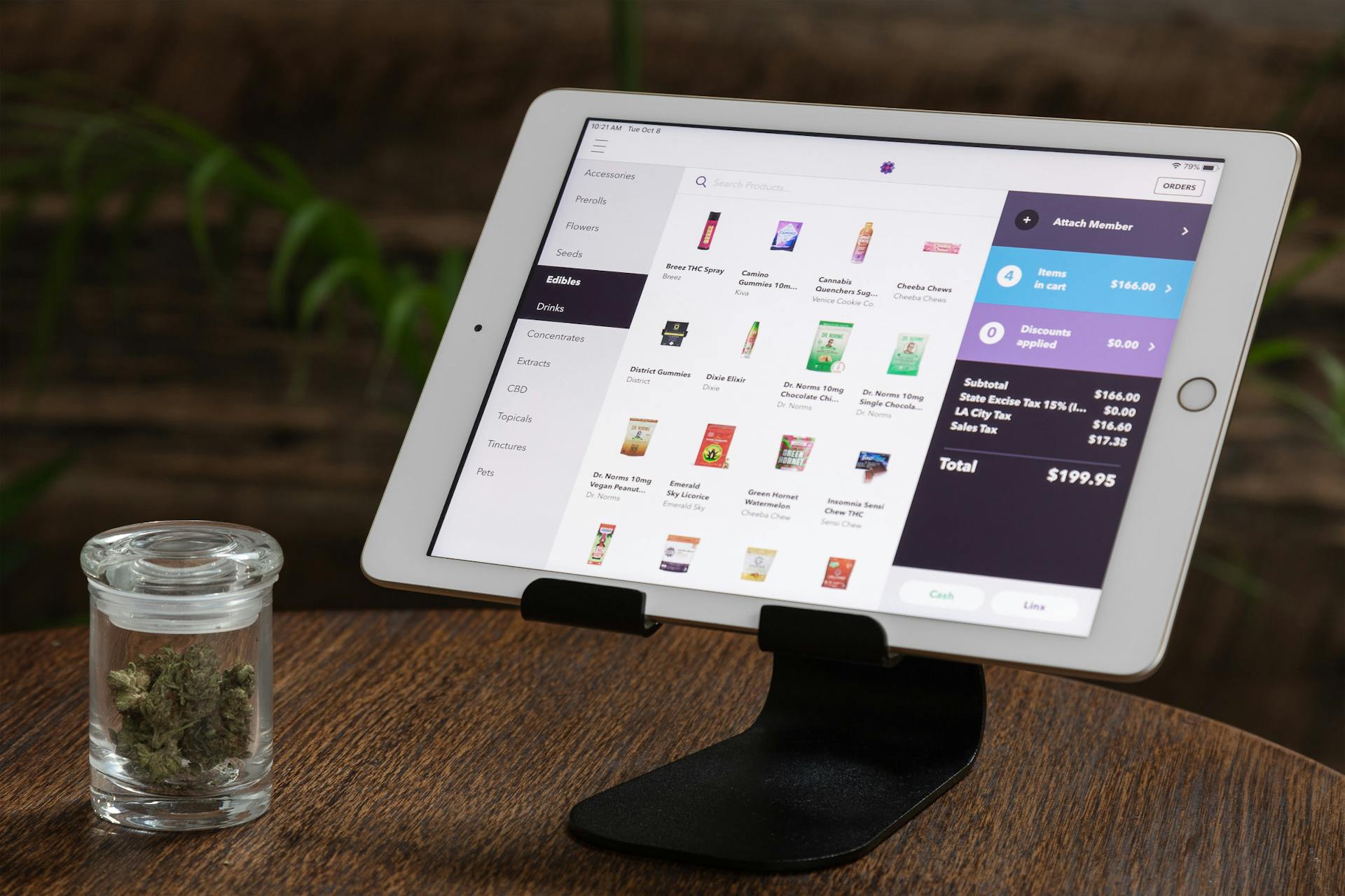 An iPad display shows the Meadow cannabis POS system