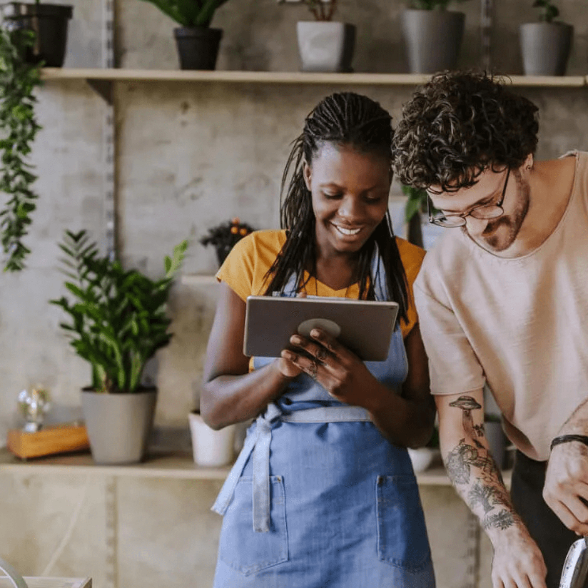 Two team members collaborate while referencing a tablet in a lush dispensary setting. This visual underscores:
Integration in Action: Real-time insights from Meadow synced with Stronghold’s payment systems help operators make smarter, faster decisions.
Empowered Teams: With everything from payments to compliance in sync, dispensaries can scale confidently and serve with purpose.